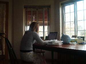 Portia sitting at laptop
